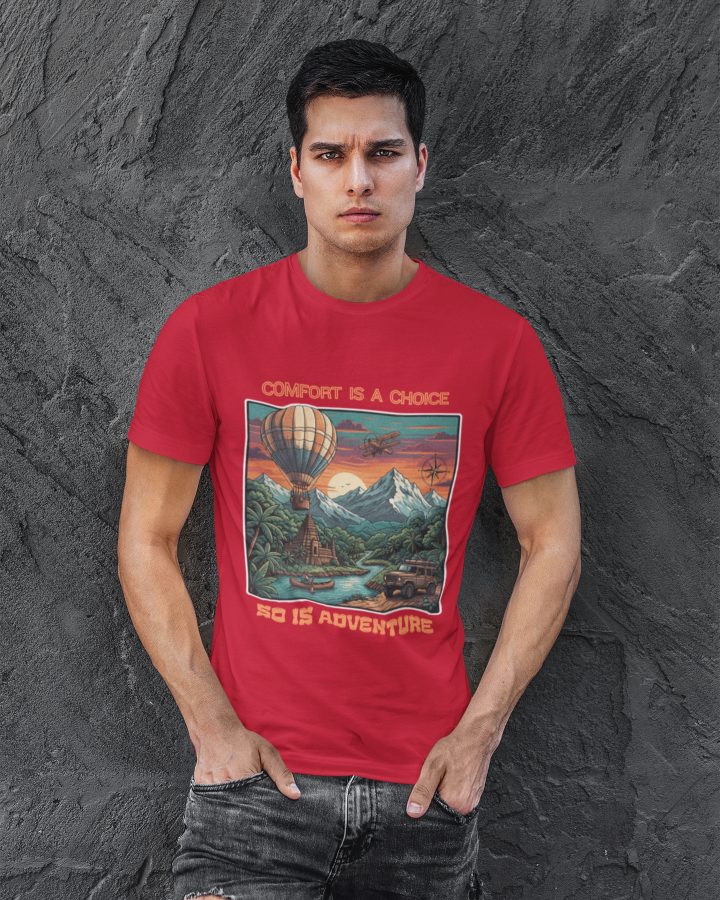 Man wearing a red t-shirt with a graphic design on a textured gray background