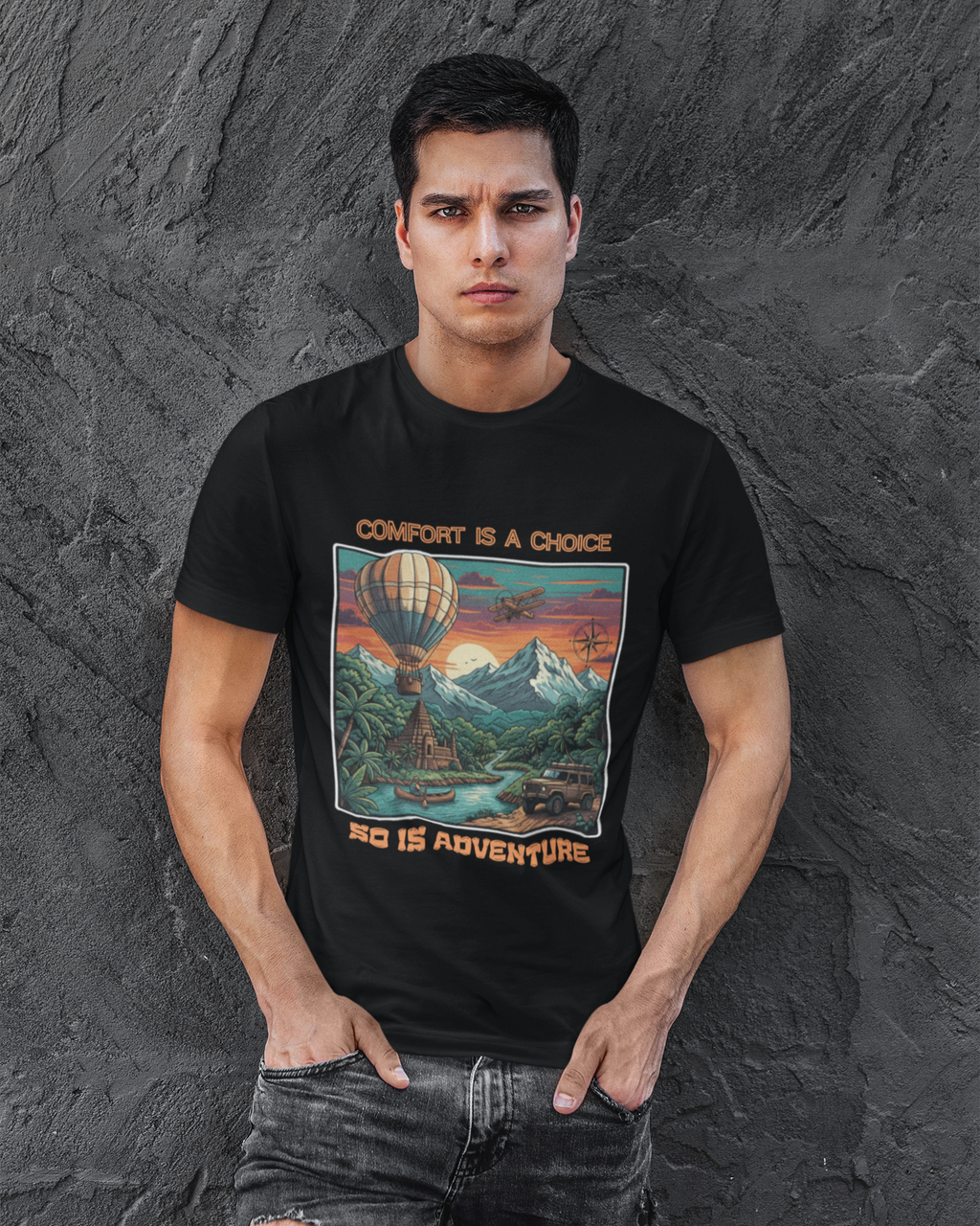 Man wearing a black t-shirt with a colorful graphic design against a textured gray background