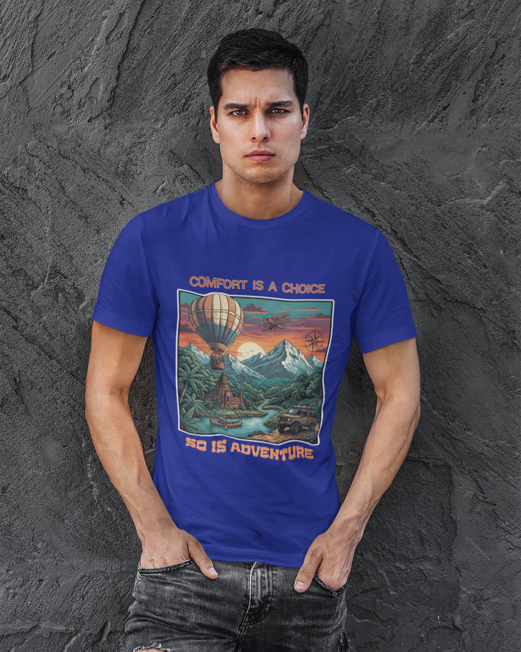 Man wearing a blue t-shirt with a graphic design against a textured gray background