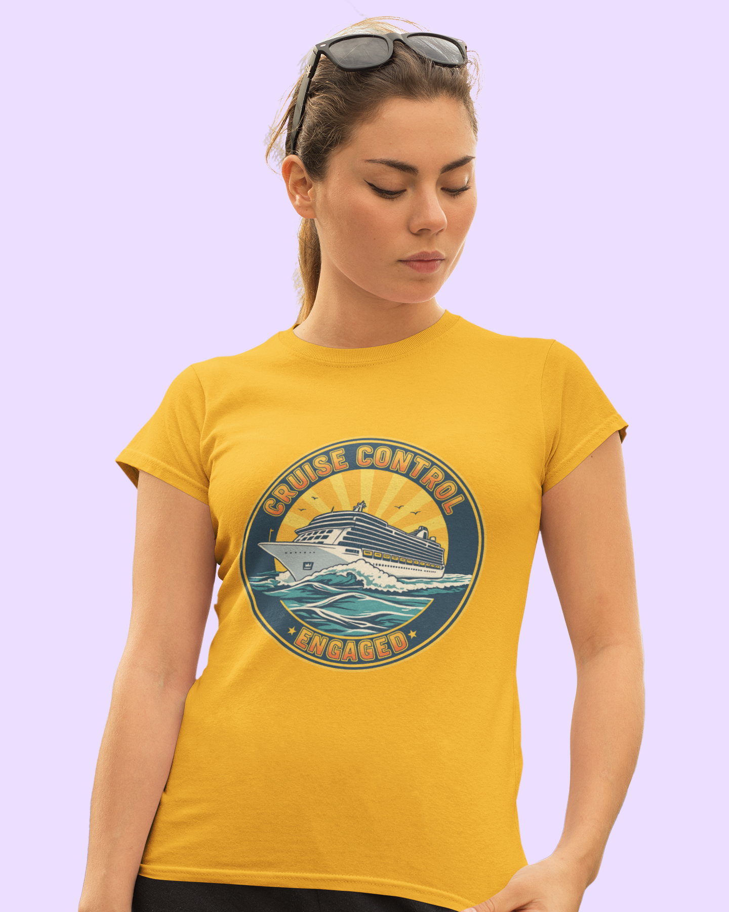 Woman wearing a yellow t-shirt with a cruise-themed graphic on a light purple background