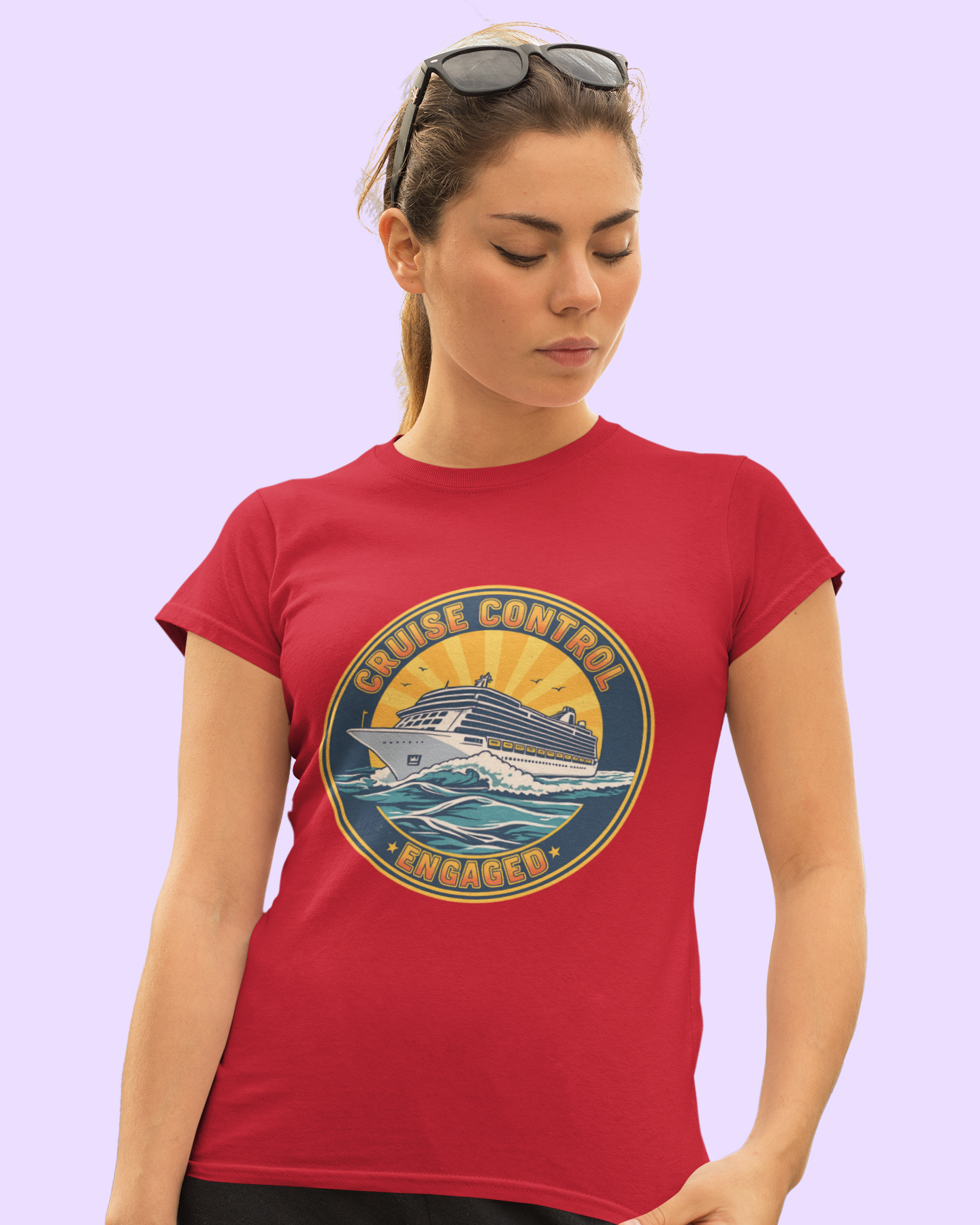 Woman wearing a red t-shirt with a graphic design on a light purple background