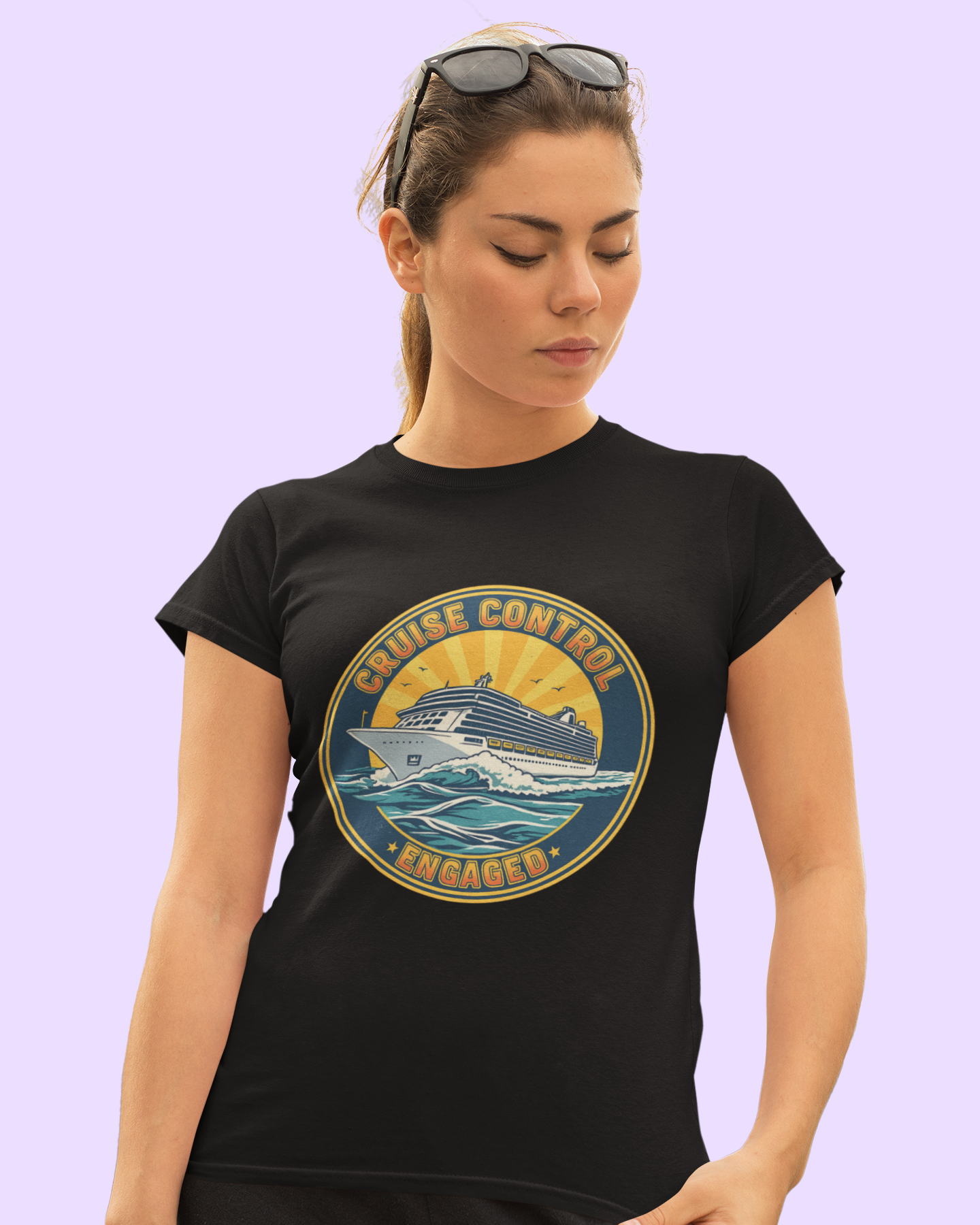 Woman wearing a black t-shirt with a graphic design on a light purple background