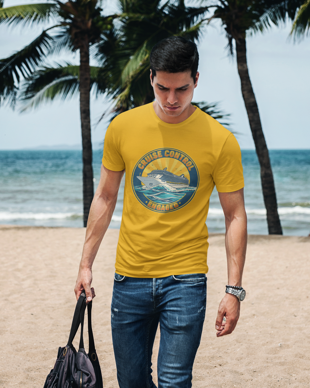 Man wearing a yellow t-shirt with a graphic design, standing on a beach with palm trees and ocean in the background.