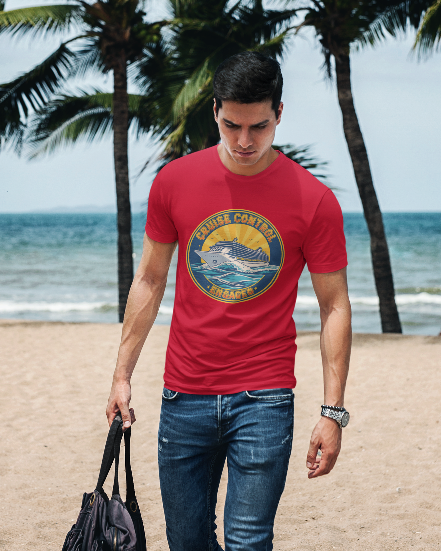 Man wearing a red t-shirt with a logo on a beach