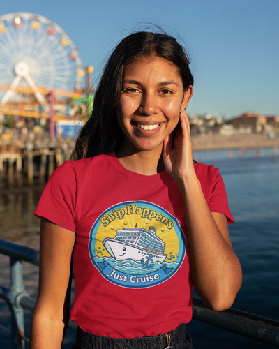Woman wearing a red t-shirt with a Ferris wheel and pier in the background