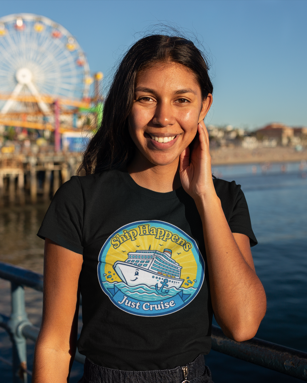 Woman wearing a t-shirt with a ferris wheel and pier in the background