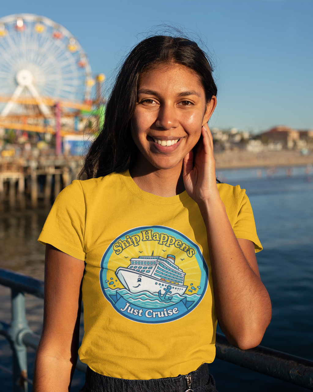 Woman wearing a yellow t-shirt with a Ferris wheel and pier in the background