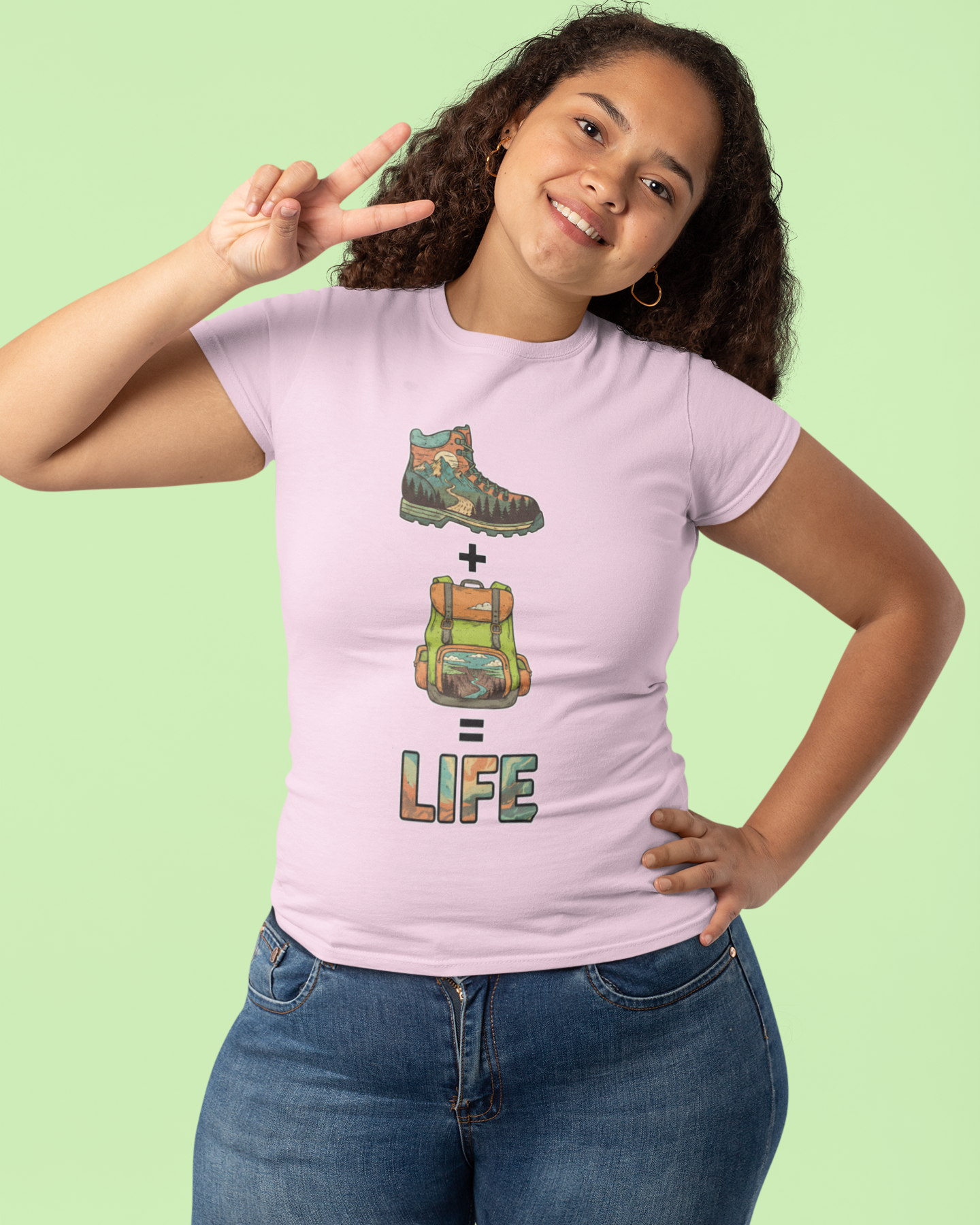 Person wearing a pink t-shirt with a graphic design and text on a light green background