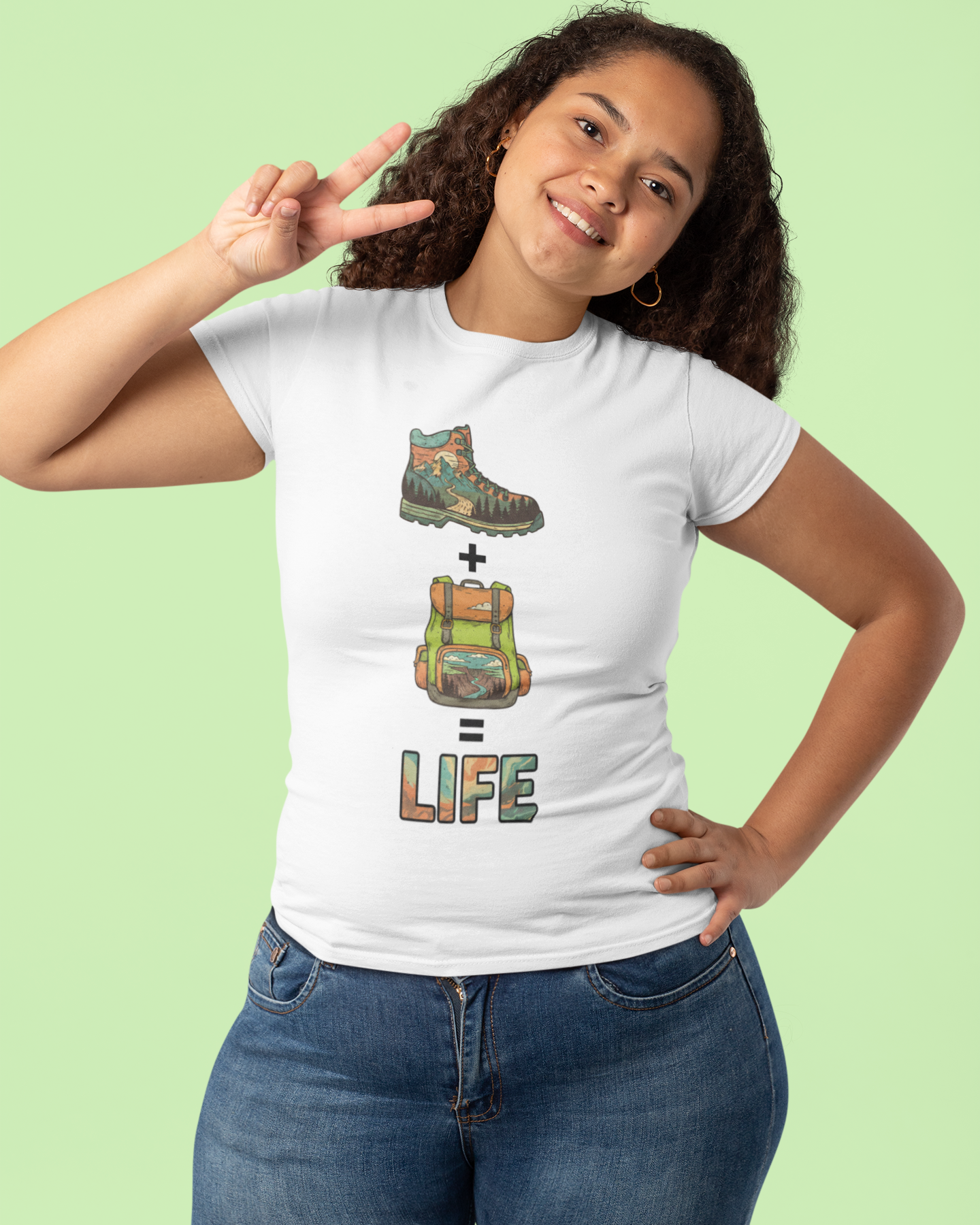 Person wearing a white t-shirt with a graphic design on a light green background