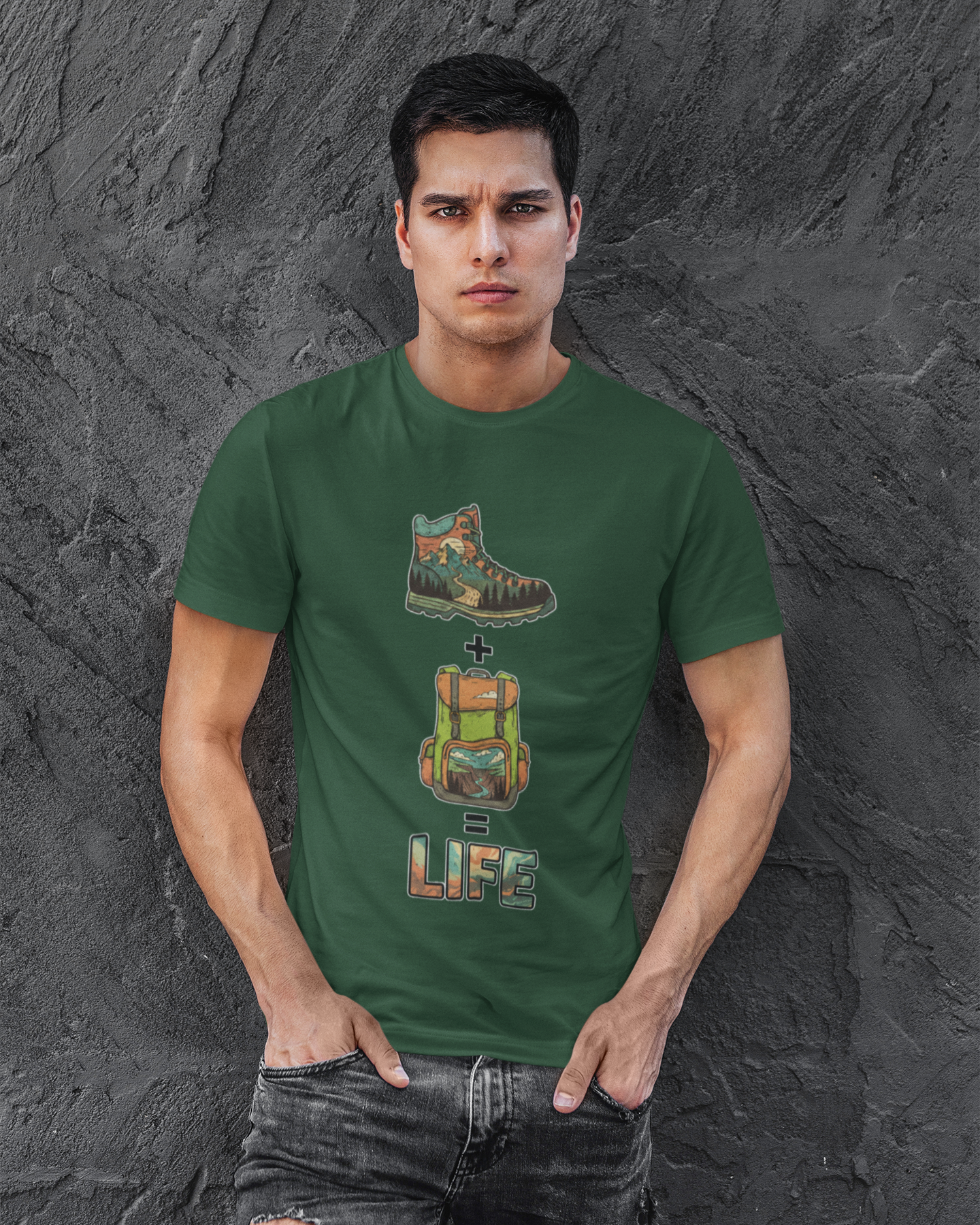 Man wearing a green t-shirt with graphic designs and text against a textured gray background