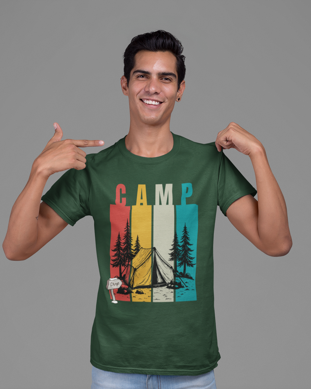 Man wearing a green t-shirt with a colorful 'Camp' design on a gray background