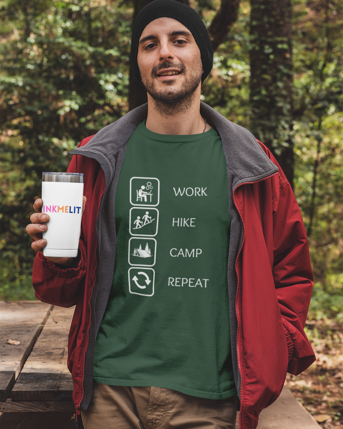 Man holding a branded cup in a forest setting