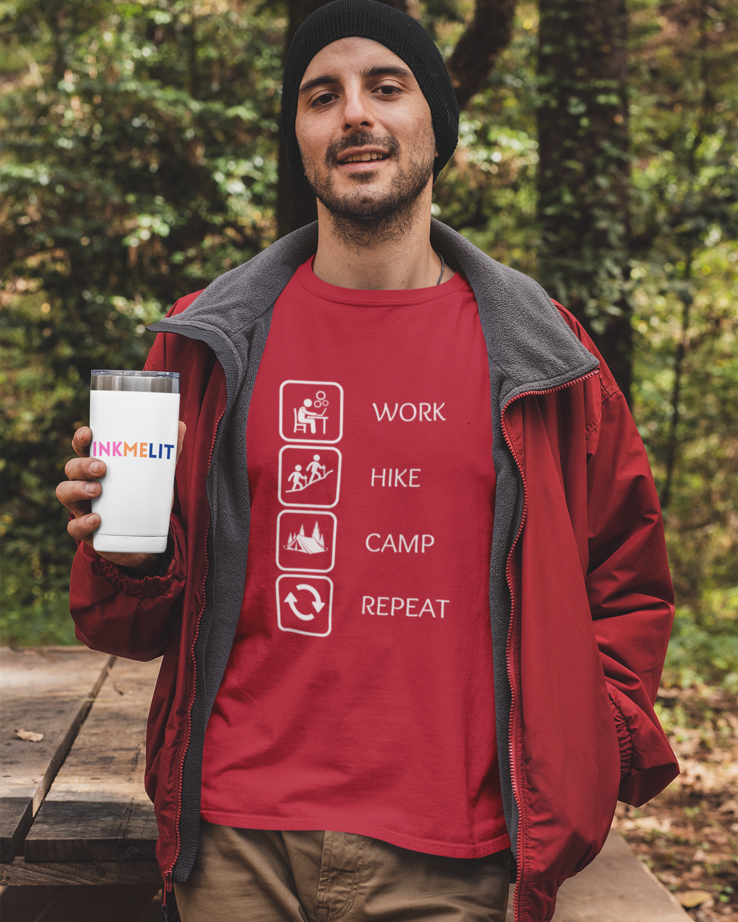 Man holding a mug with a red shirt featuring outdoor activities in a forest setting
